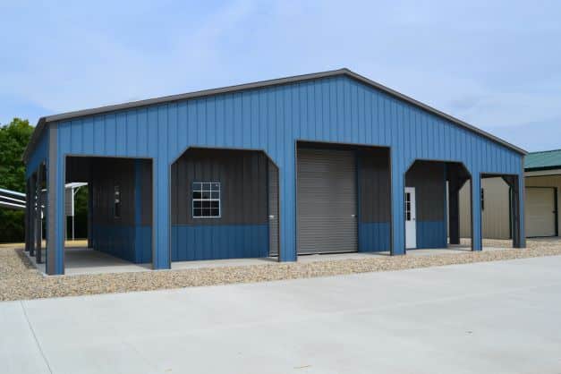 Gray and blue large metal building with various sized frame outs